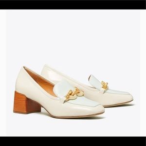 Tory Burch Jessa patent leather chain link pumps.